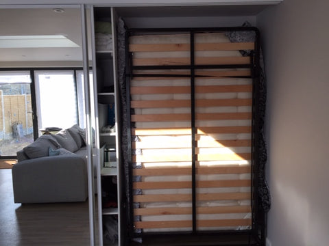 Drop-Down bed hidden away behind sliding doors