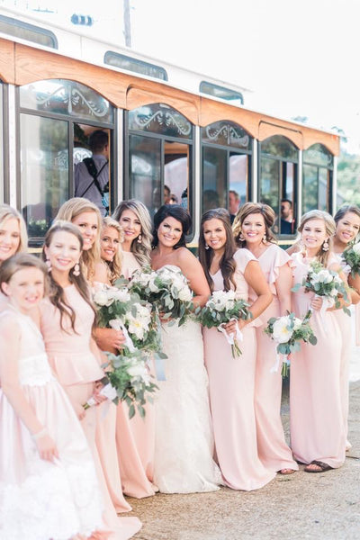Elizabeth's bridesmaids in various gown in light pink