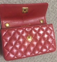Vintage CHANEL classic mini flap 2.55 shoulder bag in lipstick red lambskin with golden CC and chain strap. Popular purse back in the era.