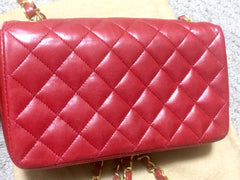 Vintage CHANEL classic mini flap 2.55 shoulder bag in lipstick red lambskin with golden CC and chain strap. Popular purse back in the era.