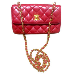 Vintage CHANEL classic mini flap 2.55 shoulder bag in lipstick red lambskin with golden CC and chain strap. Popular purse back in the era.