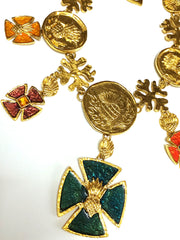 MINT. Vintage Yves Saint Laurent statement necklace with blue, wine, orange, yellow, and green colorful enamel cross and coin motif charms.