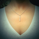 yellow gold chasing arrows pendant