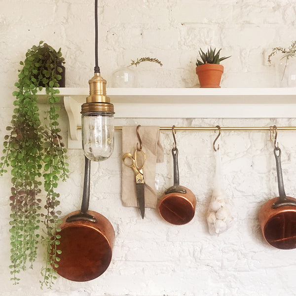 Brass waterproof pendant light in a kitchen decor