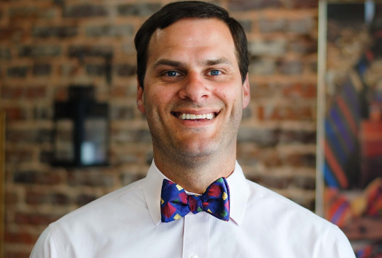 Man wearing a festive colorful bow tie