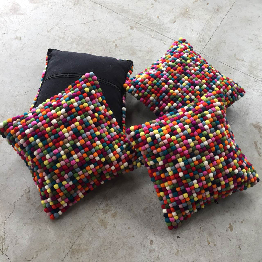 multicoloured felt ball cushion