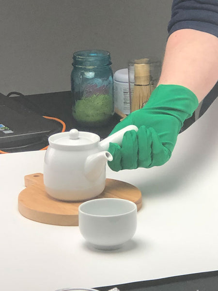 Green globe is used to lift the teapot