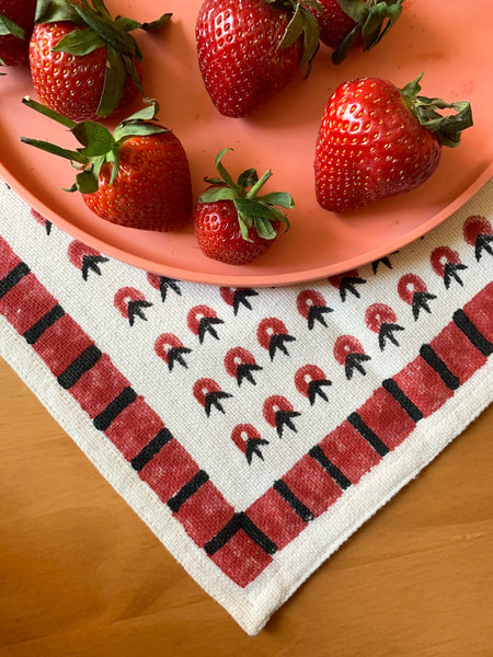 Summery red floral inspired cloth napkin by SUNDAY/MONDAY, featuring a bold geometric border. Hand block printed in India.
