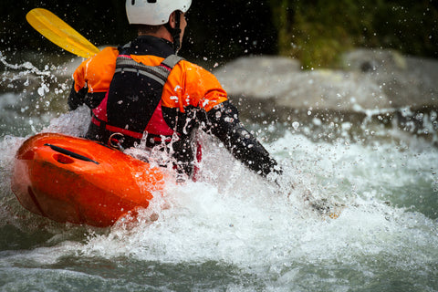 A kayaker makes his way down a whitewater rapid.