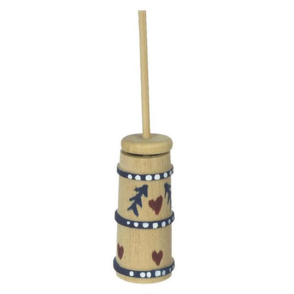 A dollhouse miniature wooden butter churn.