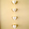 Open Heart Paper Garland hanging on wall