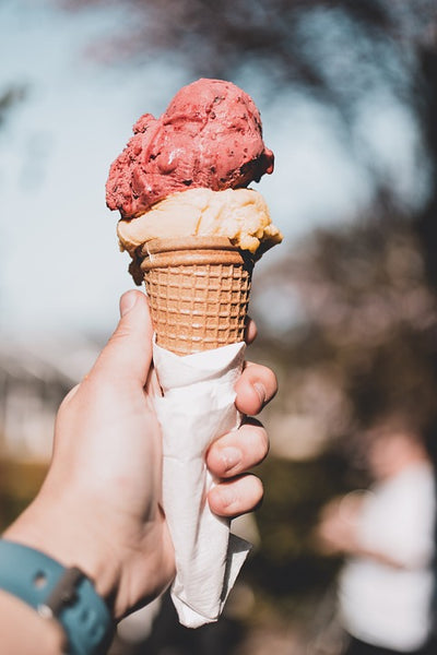 holding an ice cream cone