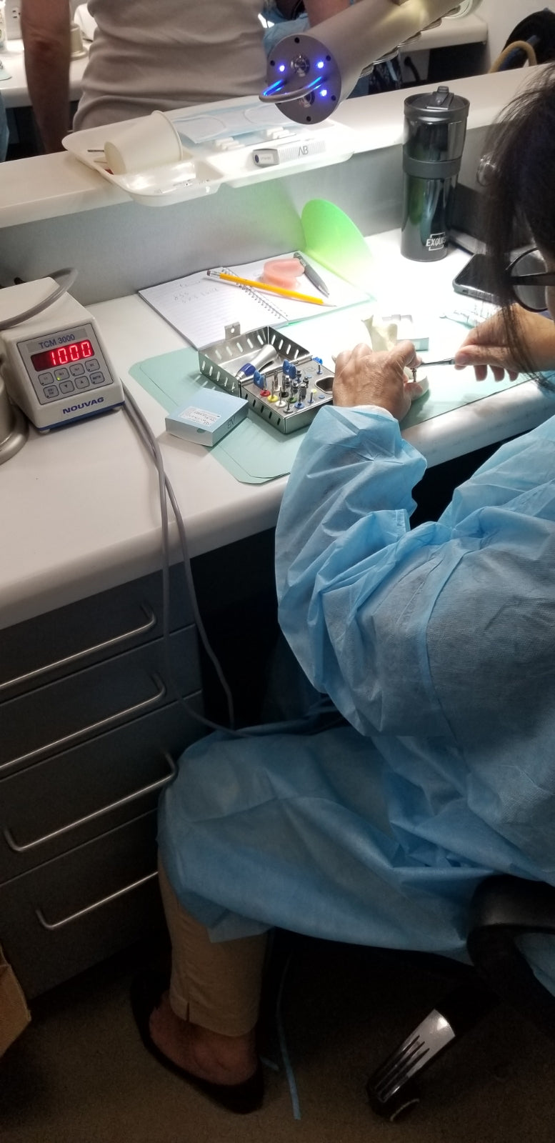 doctor using dental implant torque wrench 