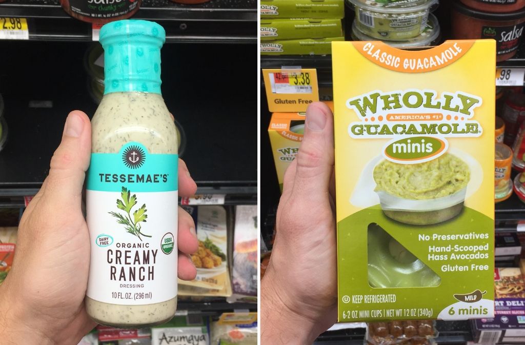 hand holding tessemae's dressing next to a hand holding a box of wholly guacamole minis