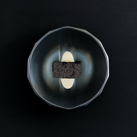 Brownie served in a Solid Black Channel Bowl