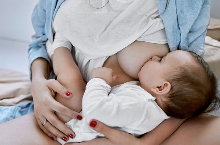 woman breastfeeding post birth