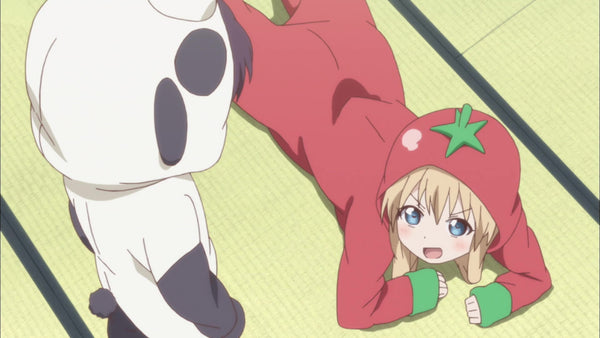 tomamto kigurumi lying in the floor while talking to her friend