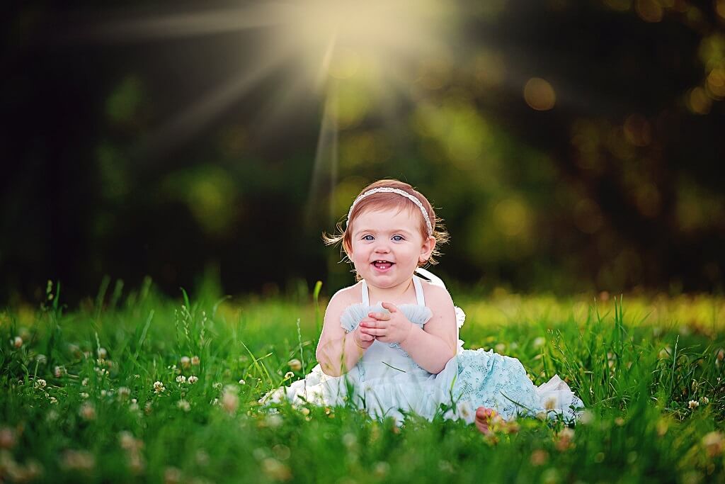 Sunburst Action added to photo of Baby in Field using Pastel Dreams Photoshop Actions