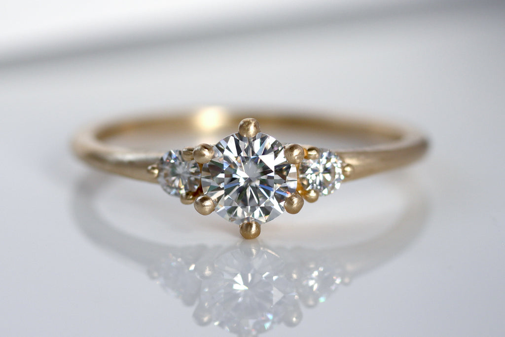 Three Stone Six Prong Moissanite Engagement Ring in Yellow Gold 