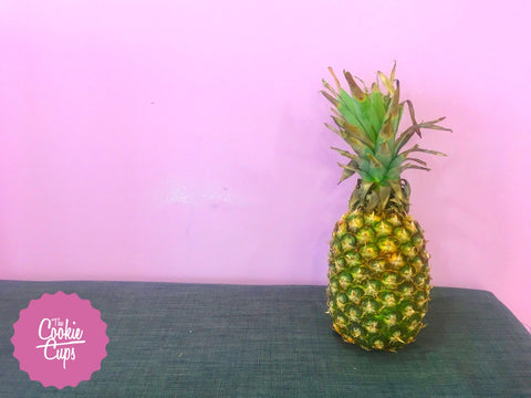 whole pineapple standing on gray table