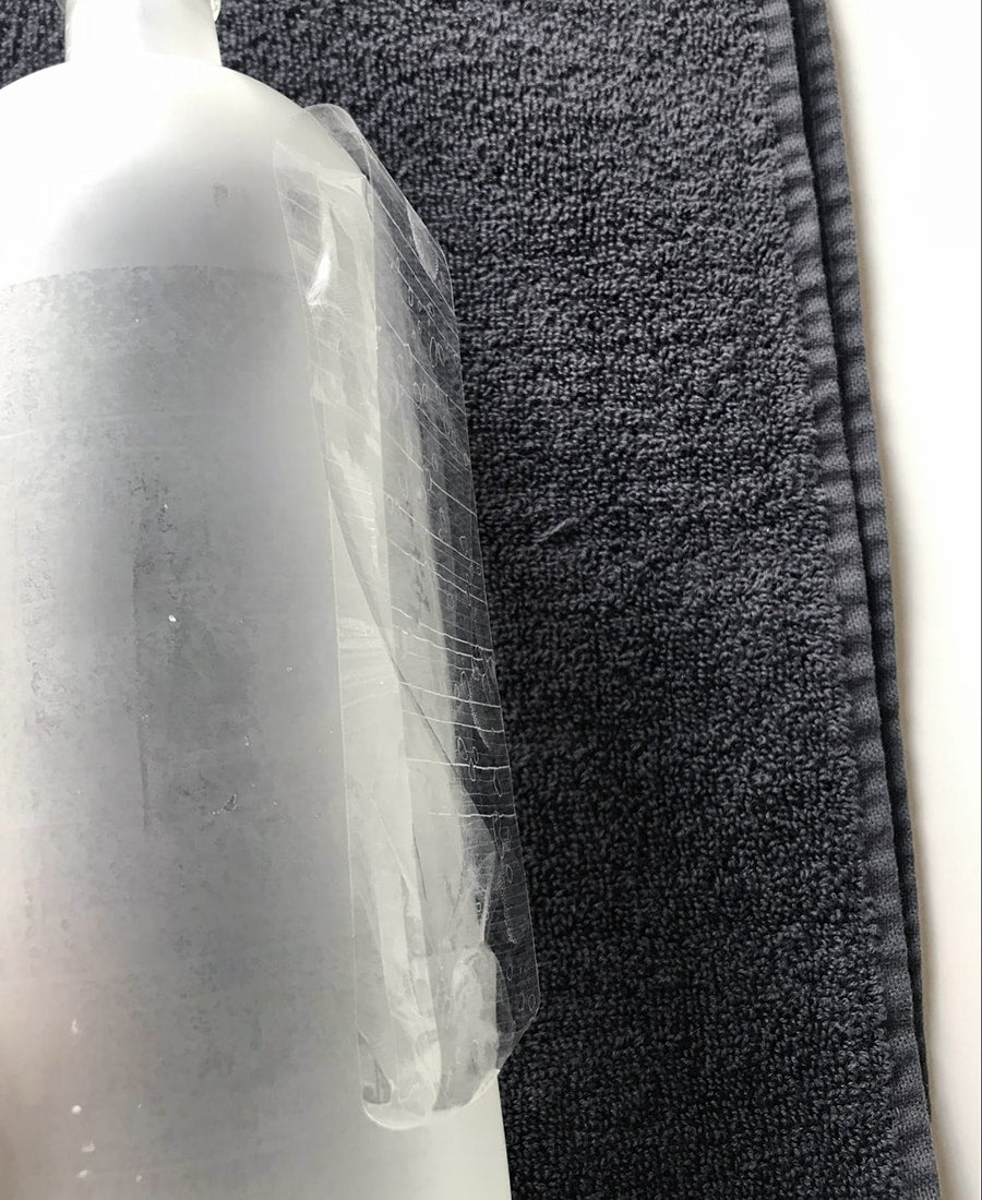 clear tape to hold the bottle