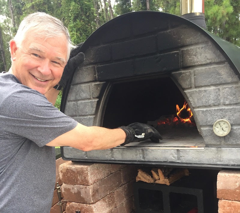 Cooking in a large wood fired pizza oven