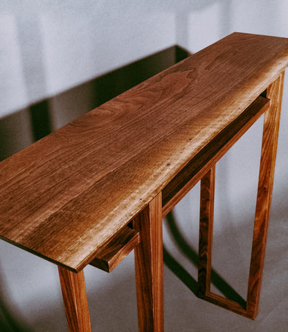 Live Edge Walnut table top on a narrow hallway table. modern wood furniture design by Mokuzai Furniture