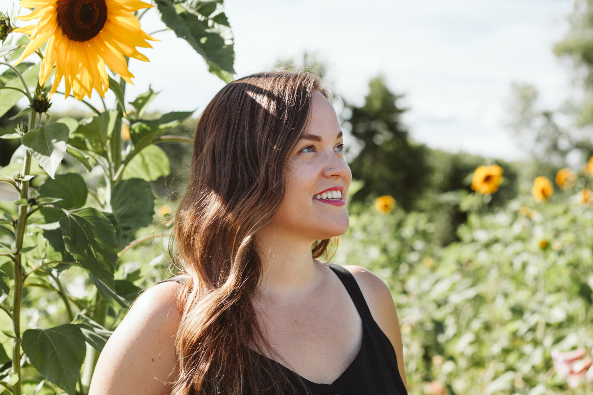 Kristen Runvik in a sunflower field
