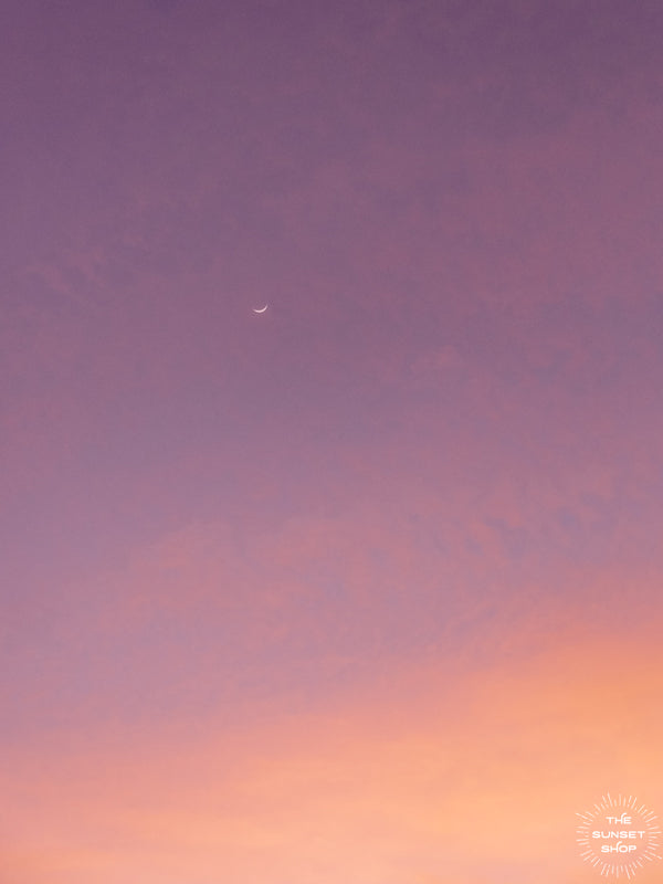 Crescent moon in a purple and rose gold pastel sunset sky in Tamarindo Costa Rica. Photo by Kristen M. Brown, Samba to the Sea at The Sunset Shop.