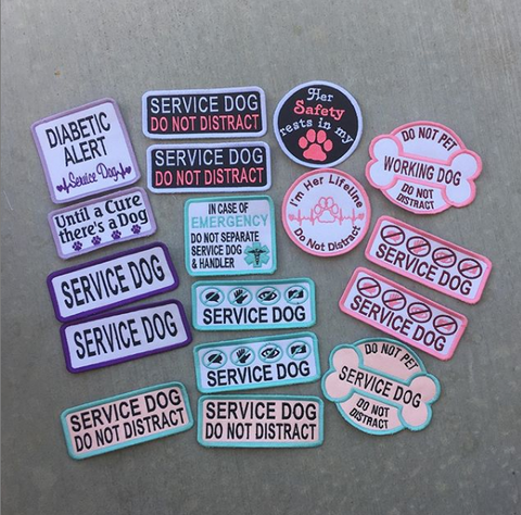 Multiple different service dog patches with all different colors and sayings