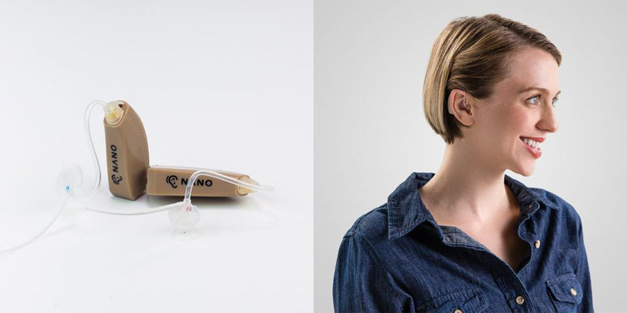 Smiling woman wearing a hearing aid