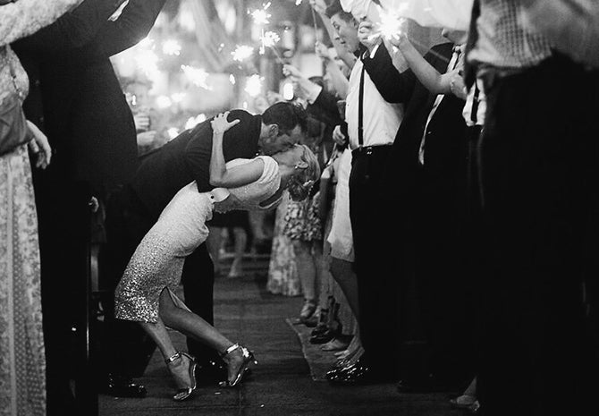 sparklers at wedding bride and groom kissing