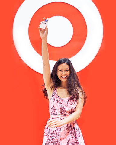 Woman holding Mighty Patch Duo in front of Target