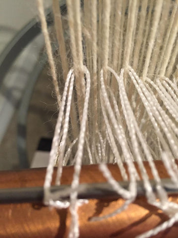 heddle on two warp threads