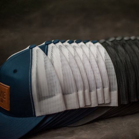 Stack of Leather Patch Trucker Hats for Family Reunions - Ox & Pine Leather Goods
