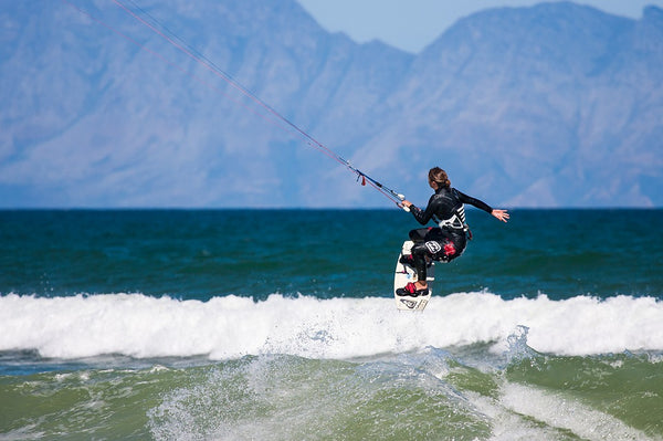 woman kiteboarding in the sea