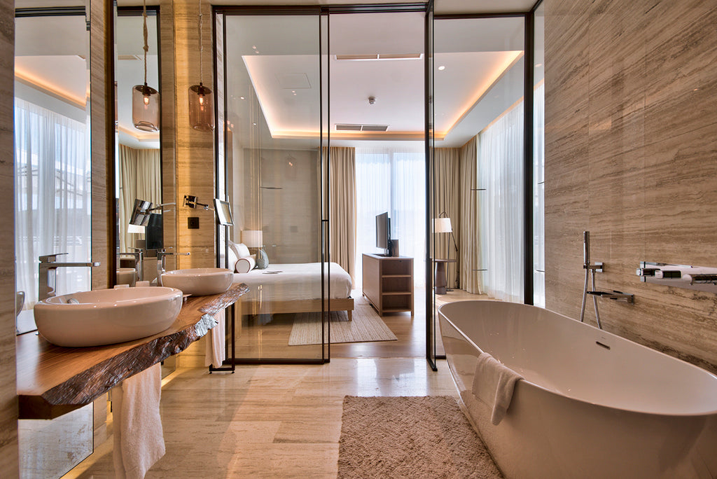 bathroom in travertine floor and wall cladding natural stone golden bay malta